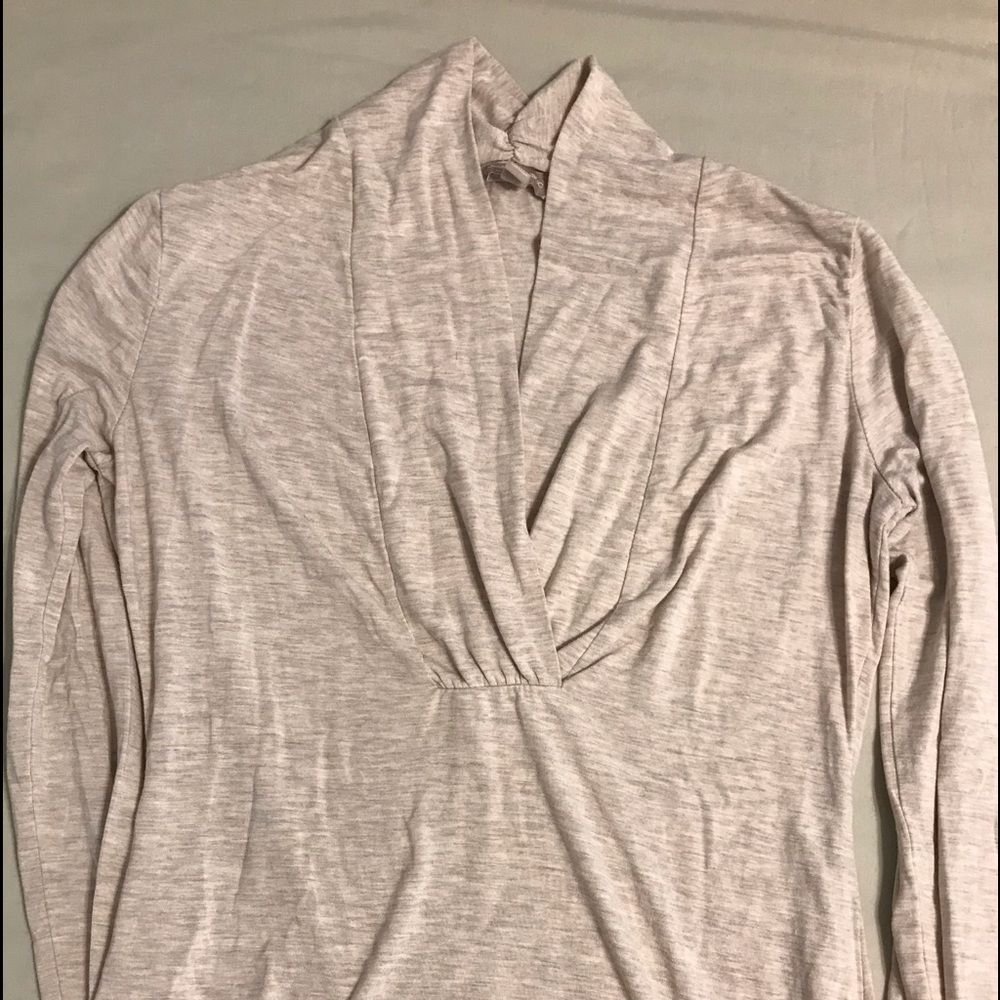 Jersey blouse v-neck. Very flattering on.